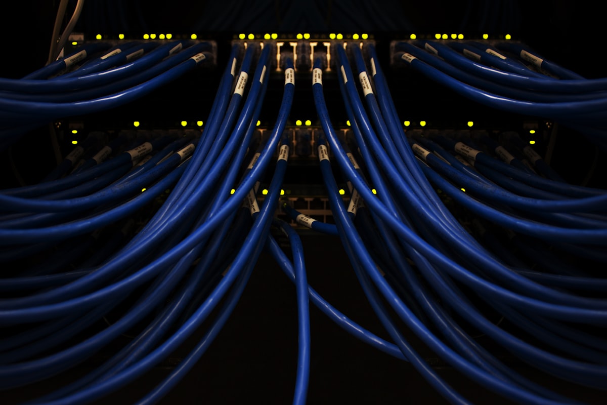 Network integration infrastructure — blue cables interconnected in a server rack