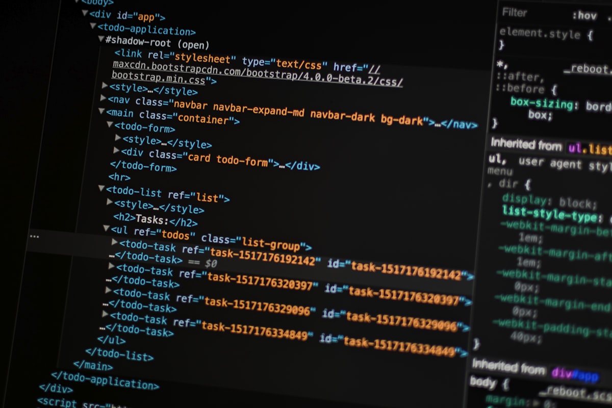 Monitor displaying source code on a dark screen, representing a developer inspecting a running software system