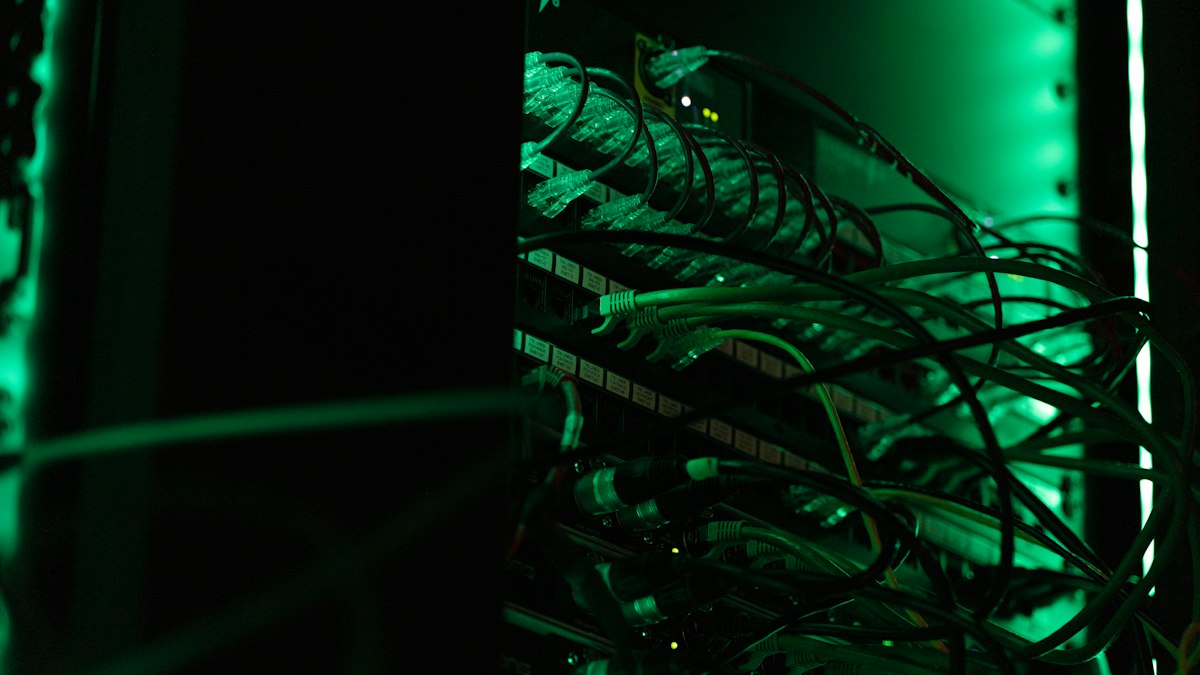Close-up of a rack of server equipment with cabling in a data center